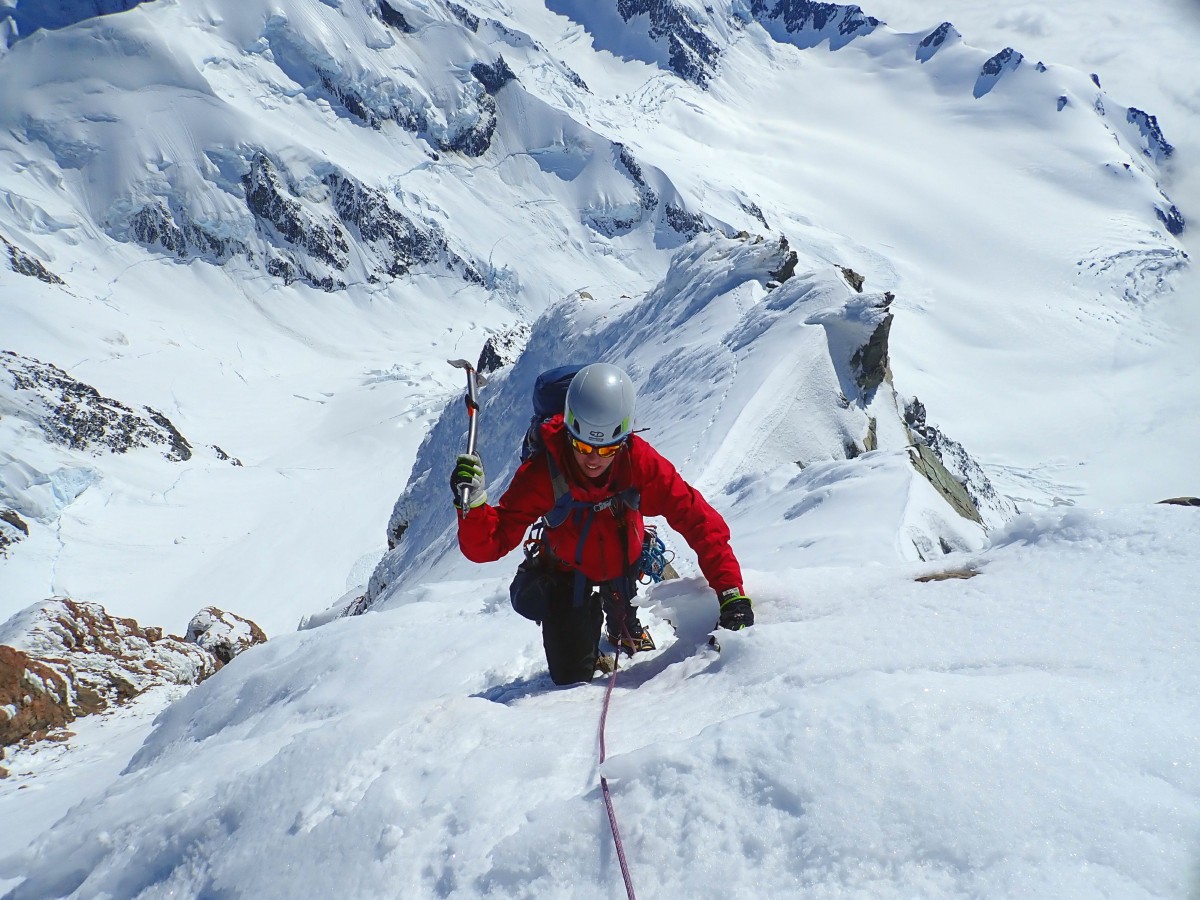 Climb Aoraki / Mt cook - climbing beyond the summit rocks towards the upper ice cap